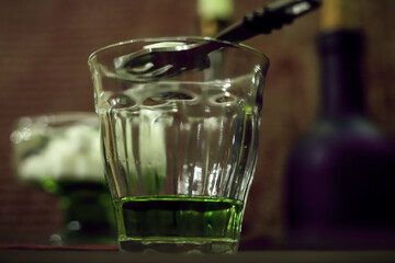 the process of making absinthe according to the old recipe close up	