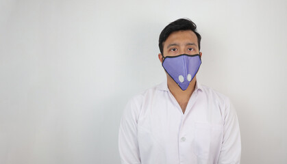 a male medical professional in white coat and mask in white background. concept image for viral infection precaution