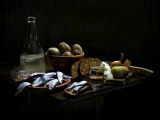Herring, boiled potatoes, black bread, moonshine. Country dinner. Still life on a black background.