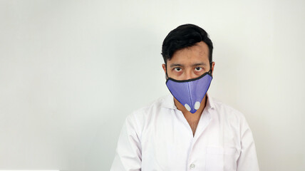 a male medical professional in white coat and mask in white background. concept image for viral infection precaution