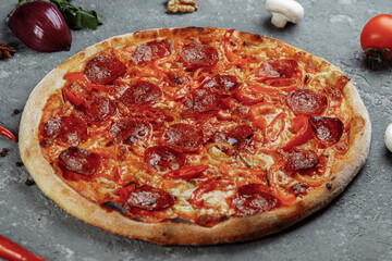 Thinly sliced pepperoni is a popular pizza topping in American-style pizzerias