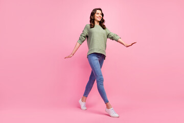 Full size profile side photo of candid nice sweet girl enjoy free time spring fall holidays go walk wear modern outfit sweater footwear isolated over pastel color background