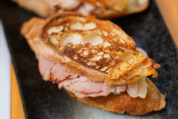 hot  grilled sandwich with ham and cheese