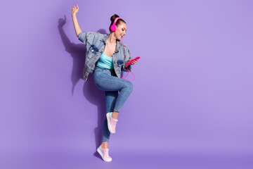 Full size photo of crazy positive cheerful girl have rest relax use smartphone listen music headset...