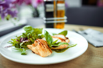 grilled chicken breast and salad