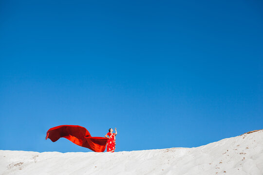 Indian woman on the top of sand barkhan.