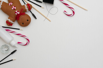 Beauty, brow and lash treatment products in a flat lay style with a white background.  Christmas beauty theme background with copy space for text and customization