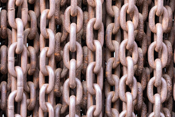 Old rusty chains illustrating a concept of terror and iron curtain