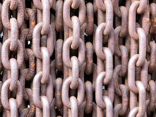 Old rusty chains illustrating a concept of terror and iron curtain
