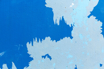 Blue paint peeling from wall