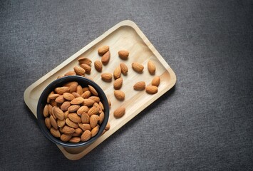 nuts on a wooden table,raw almond for making bakery