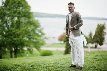 Stylish pakistani man wear in eyeglasses and jacket.