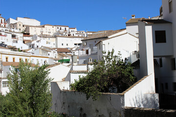 Street with white houses in Setenil de las Bodegas, village in the province of Cádiz (Andalusia, Spain) 