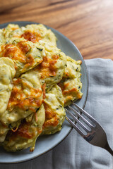 vegetarian Zucchini Fritters on a grey plate, grey background
