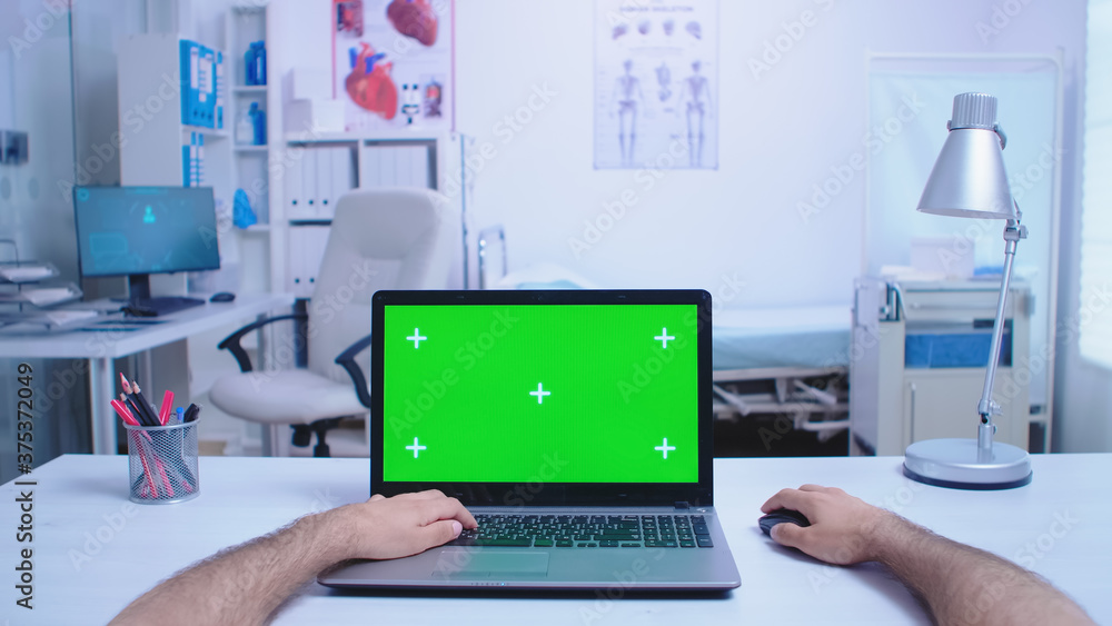 Aufkleber pov of assistant using laptop with copy space available in hospital cabinet and doctor working on co