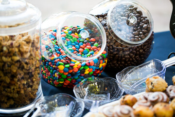 variety of candy in jars 