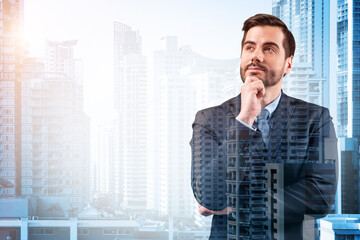 Young handsome businessman in suit with hand on chin thinking how to succeed, new career opportunities, MBA. Bangkok on background. Double exposure.