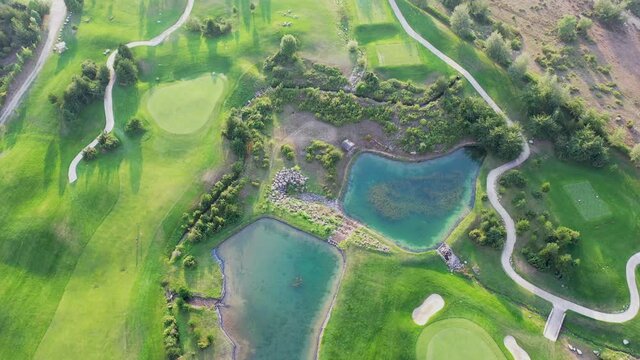 Aerial view of golf courses. Bulgaria, a village in Balkan mountains, Pirin range.