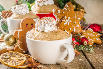 Christmas traditional gingerbread in mug. Simple and fast recipe idea for Christmas breakfast, mugcake in microwave with traditional winter spices, on xmas decorated wooden background copy space