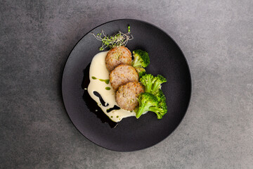 chicken cutlets with broccoli in a creamy sauce