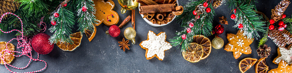 Christmas background. Table for cooking Christmas holiday baking cookies and cakes with ingredients above copy space