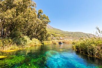 Taking tour on Azmak Stream in Akyaka Village. Akyaka is popular tourist destination in Turkey.