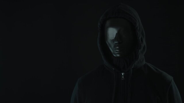 Unknown man wearing black and glowing light bar