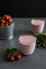 Two glasses of strawberry smoothie. Strawberry milkshake