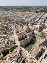 Aerial view Basilica Minore Pontificia Santissimo Rosario in old town Francavilla Fontana cityscape Puglia Italy. Catholic church religious baroque architecture. Sport ground near christian cathedral