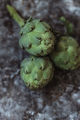 Fototapeta premium Fresh green artichokes. Top view. Copy space
