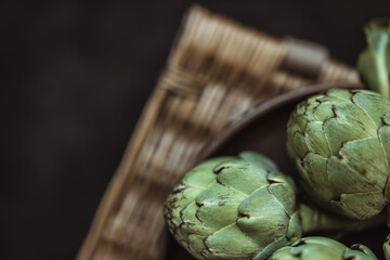 Obraz premium Fresh green artichokes. Top view. Copy space