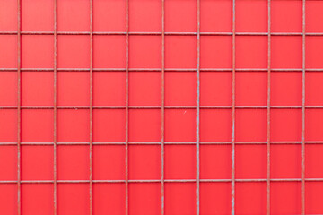 a large construction grid lies on a red background