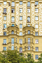 Wall of a residential building of the Stalinist era, richly decorated with bas-reliefs with floral ornaments