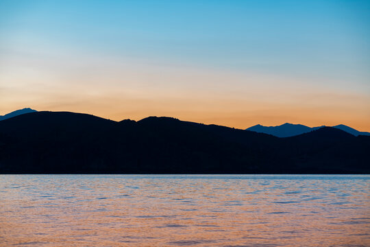 Beautiful sunrise landscape. The Mountains and lake early morning. Sevan National park Armenia.