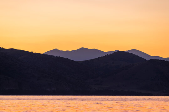 Beautiful sunrise landscape. The Mountains and lake early morning. Sevan National park Armenia.