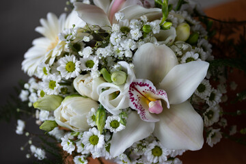 Close up, macro flower bouquets with orchid and white flowers. Holy communion, wedding.
