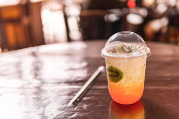Strawberry and kiwi cocktail on wood table