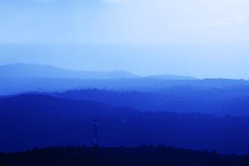 Mountains summer landscape with blue colors gradient of mountain peaks, nature travel outdoor background.