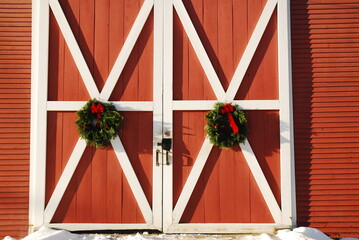 Christmas wreaths on a New England barn © kirkikis
