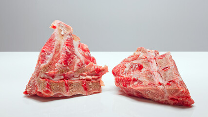 Obraz na płótnie Canvas Fresh Raw Meat On Bone Isolated On White Image Series.