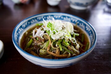 Japanese soba noodle with edible wild plants.