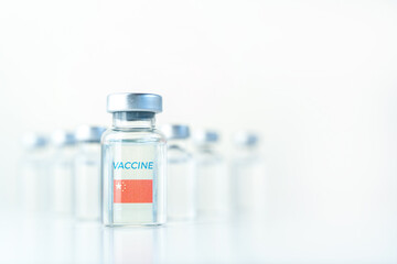 Transparent vials with China flag. Vaccine for covid-19 coronavirus, flu, infectious diseases. Injection after clinical trials for vaccination of human, child, adult, senior. Medicine, drug concept
