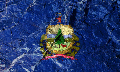 The national flag of the US State of Vermont on a blue background with the coat of arms in the...