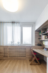 Children's room with table, wardrobe and toys