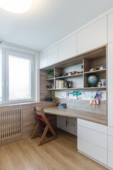 Children's room with table, wardrobe and toys