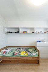 Children's room with bed and cabinets
