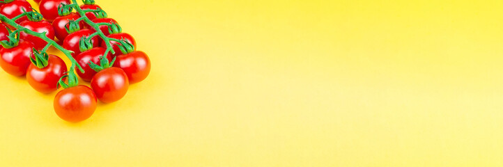 cherry tomatoes on yellow background