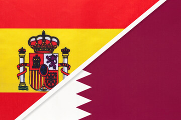 Spain and Qatar, symbol of two national flags from textile. Partnership between European and Asian countries.