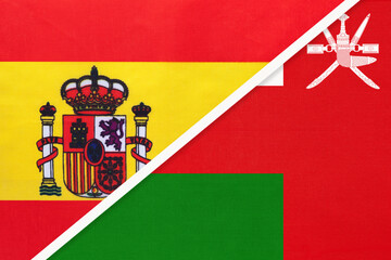 Spain and Sultanate of Oman, symbol of two national flags from textile. Partnership between countries.