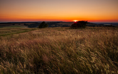 June sunset from Willingdon Hill on the south downs near Eastbourne east Sussex south east England. 